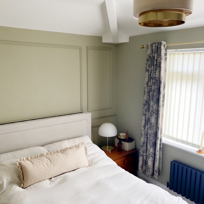 Green panelled bedroom